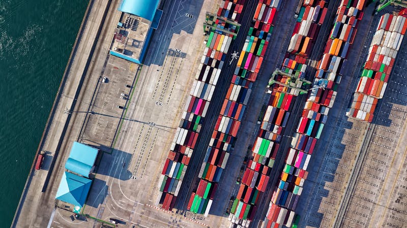 Container port with cranes loading cargo representing ocean freight services